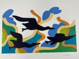three birds flying in the sky above the water