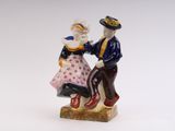 a figurine of a man and a woman dancing