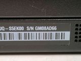 a close up of a laptop with a barcode on it