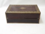 an image of a wooden box with a decorative design on the lid