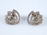 a pair of diamond earrings on a white background