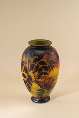 a vase that is sitting on a stand on a white surface