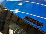 a close up of a blue surfboard on display in a shop