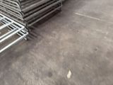 a lot of metal racks that are stacked on top of each other