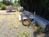 a lot of wooden benches in the middle of a field