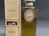 an image of a bottle of cologne next to a box of perfume