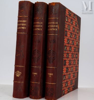 trois livres sont empilés sur une table