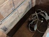 a wooden box with a bunch of wires inside of it