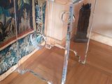a glass table with a bowl on top of it