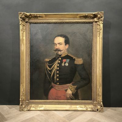 portrait of a man in a military uniform in a gold frame