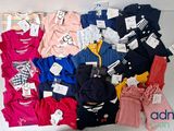 a lot of clothes that are on a table