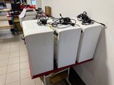 three speakers that are sitting on top of a table