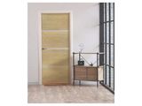 the interior of a room with a wooden door and a shelf