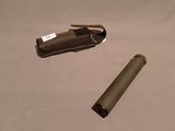 a lighter and a lighter case sitting on a table