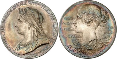 a close up of a coin with a woman ' s face on it
