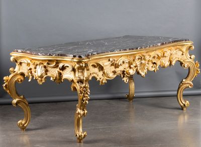 an image of a table with a marble top and gold decorations