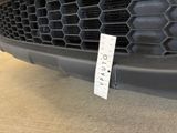 a picture of a close up of a car ' s grille
