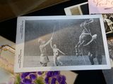 a black and white photo of a man playing polo