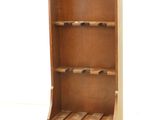 an image of a wooden wine rack with wine bottles on it