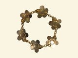a close up of a bracelet on a white background