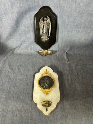 two pieces of wall art with a clock and a picture of an angel on a plaque