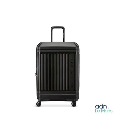the black suitcase is sitting on wheels on a white surface