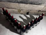 several bottles of wine are arranged in a row on a counter