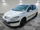 a picture of a white car parked in a garage