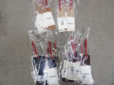 six bottles of wine wrapped in plastic bags sitting on a table