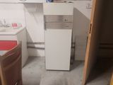 an image of a kitchen with a sink and a refrigerator