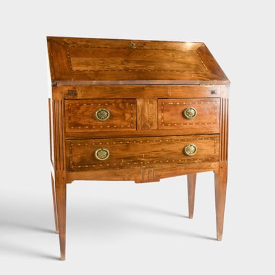 an image of a small wooden desk with drawers