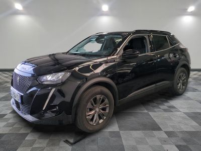 the black suv is parked on a checkered floor in the garage