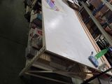 a table that has a lot of items on it in a room