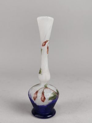 a close up of a glass vase on a white surface