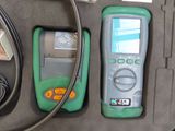 a green and black electronic device in a case
