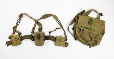 pair of military shoulder holsters on a white background