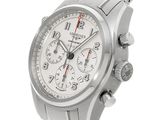 a close up of a watch on a white background
