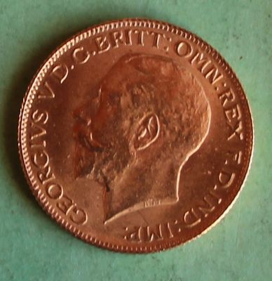 a penny that is on a table with a green surface