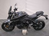 a picture of a motorcycle parked on a checkered floor