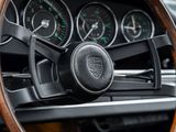 a steering wheel and dashboard of a classic car
