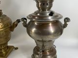 three different types of metal objects are displayed on a white surface