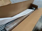 a box that has a sheet on it and a roll of paper in it