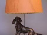 an image of a lamp with a dog on it and a lamp shade on it