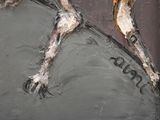 a painting of a dog laying down on the ground