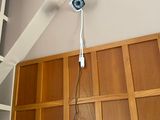 a ceiling fan that is hanging from the ceiling in a room