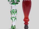 two glass vases that are sitting next to each other