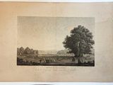 une vieille photo représentant une ferme avec un arbre en arrière-plan