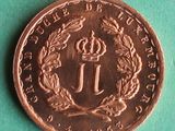an image of a coin with a crown on it on a green surface