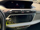the dashboard of a car with a digital display in the center of it