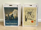 two bags with a picture of a city and a palm tree